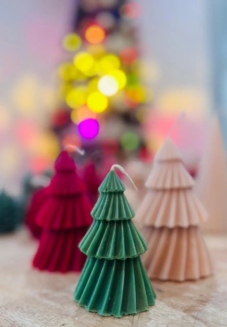 Red, green and nude candles of pine trees.