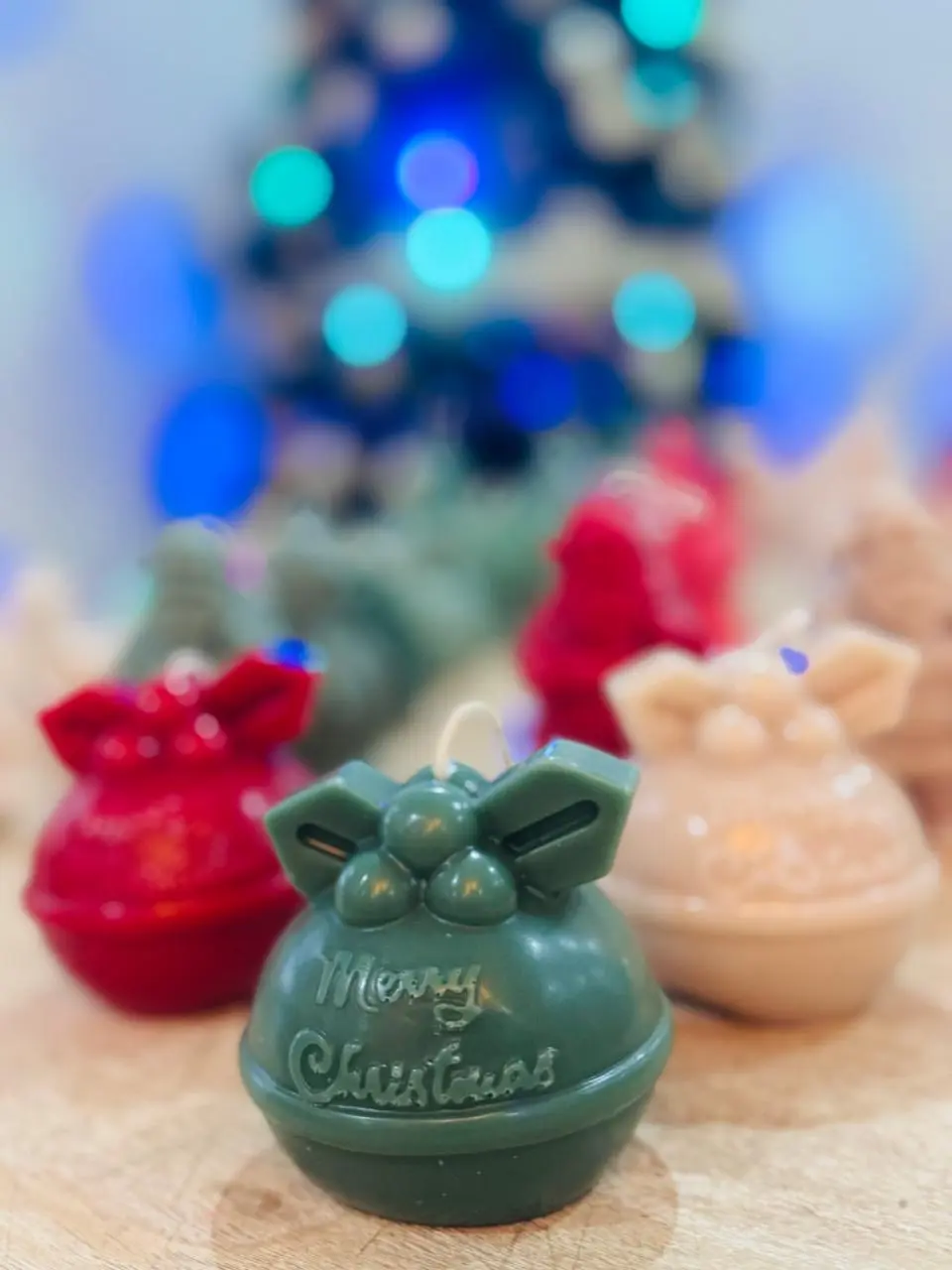 Red, green and nude candles of Christmas decoration.