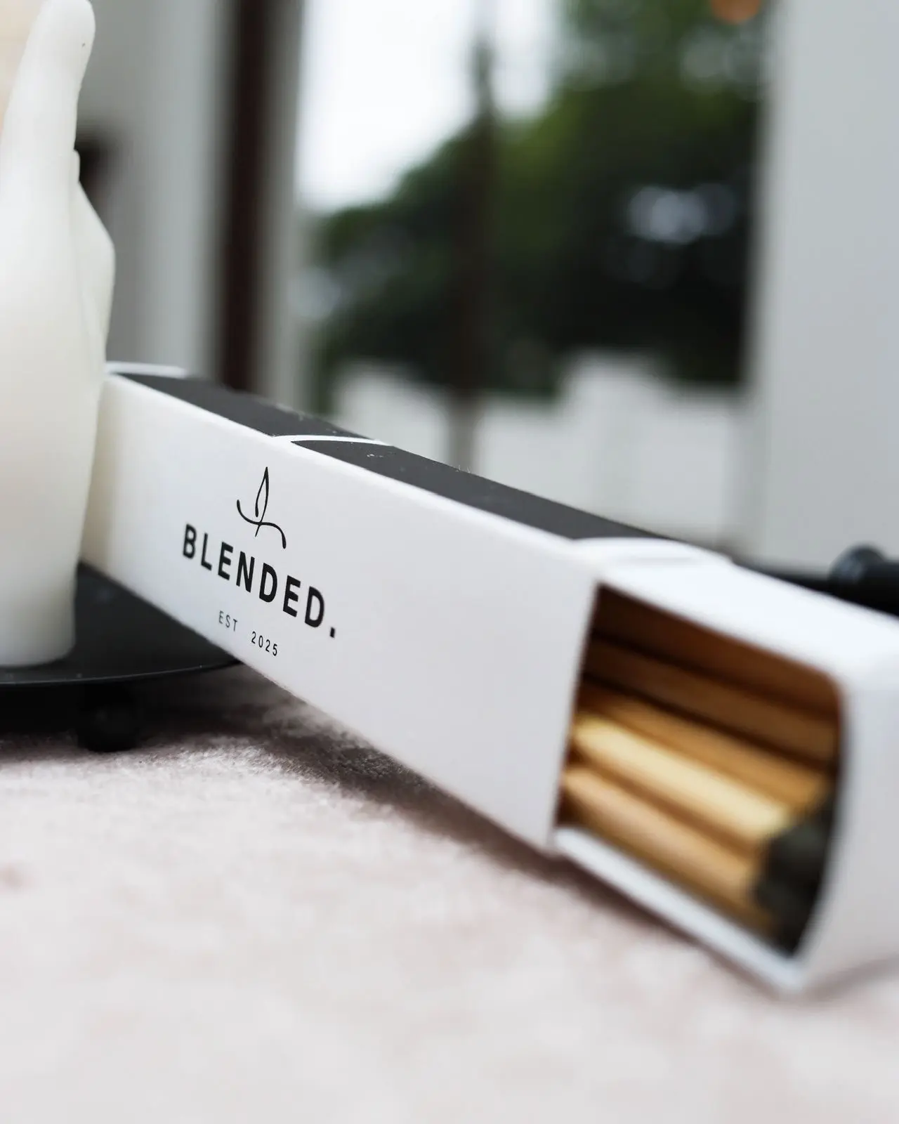 Box of BLENDED Candles branded matches.
