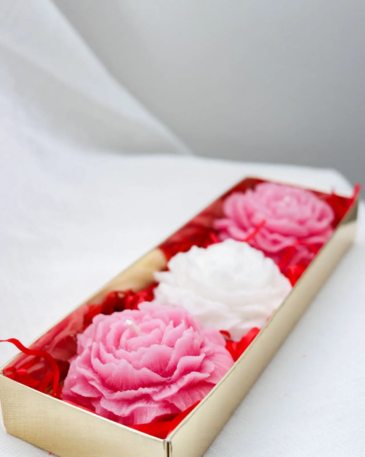 Pink and white rose candles.